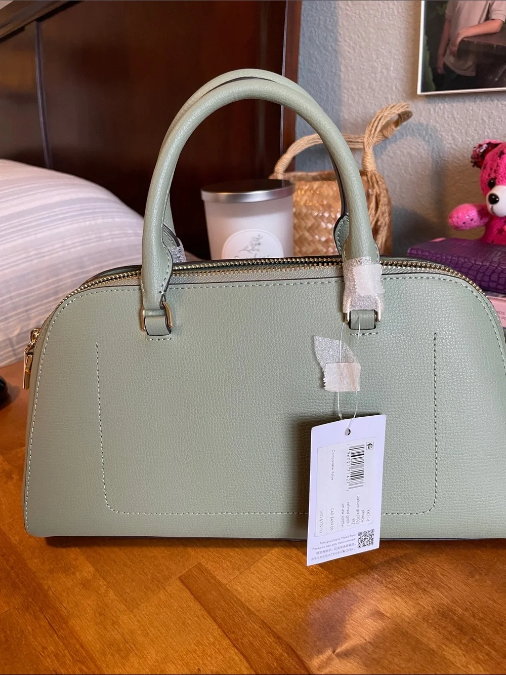 The Kate Spade KK114 refers specifically to the Phoebe East West Satchel
